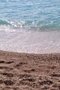 Exotic sandy beach, tropical blue mediterranean sea with waves and sea foam. Beautiful natural environment, panorama, landscape. Royalty Free Stock Photo