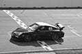 Sportscar crossing Finish Line of Racetrack Royalty Free Stock Photo