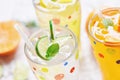 Exotic summer drinks refreshing variety of cold drinks glasses fresh fruit on ice homemade cocktail tea with mojito lemon lime Royalty Free Stock Photo