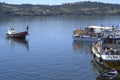 traditional wooden facade houses on stilts (palafitos) with fishermen boats in Castro, Isla de Chiloe, Patagonia, Chile