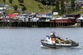 traditional wooden facade houses on stilts (palafitos) with fishermen boats in Castro, Isla de Chiloe, Patagonia, Chile