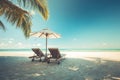 Exotic travel destination, loungers and umbrella under palm leaf. Luxurious tropical beach landscape Royalty Free Stock Photo