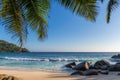 Exotic Tropical beach at sunset and coconut palms on Seychelles. Royalty Free Stock Photo