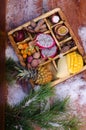 Exotic, tropical fruits in a box - mango, pineapple, kumquat, dragon fruit, passion fruit, tamarind, mangosteen, winter background Royalty Free Stock Photo