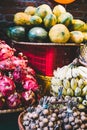 Exotic and tropical fruits on the market of Thailand, Vietnam. Mini bananas, longan, pitaya Dragon Fruit, papaya Royalty Free Stock Photo