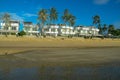 Exotic tropical vibrant coastal resort waterscape with holliday homes in a blue sky over ocean water. Thailand Royalty Free Stock Photo