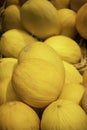 Yellow melons pile in a box Royalty Free Stock Photo