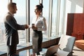 Expand your business connections and watch your success grow. two businesspeople shaking hands in an office. Royalty Free Stock Photo