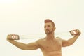 Expander in hands of man with muscular body workout Royalty Free Stock Photo