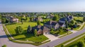 Expansive Aerial View of Lush Suburban Neighborhood with Curving Streets