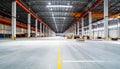 Vast Empty Warehouse Interior with Concrete Floor and Support Columns Royalty Free Stock Photo