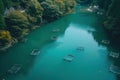 Aerial View of a Geometric Fish Farm in Lush Green Surroundings Royalty Free Stock Photo