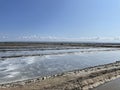 Flat Horizon of Salt Pans: Industrial Scale Extraction and Mineral Gathering. Royalty Free Stock Photo
