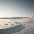 Undulating snowdrifts, creating patterns and shadows across the Royalty Free Stock Photo