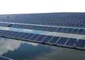 Expansive solar farm generates clean energy reflecting on calm water surface Royalty Free Stock Photo