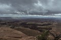 Expansive view of canyonlands under a dramatic, overcast sky Royalty Free Stock Photo