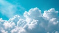 Expansive view of soft, fluffy cumulus clouds against a bright blue sky, serene and peaceful