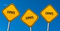 Expats - yellow signs with blue sky Royalty Free Stock Photo