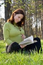 Expectant mother reads the book