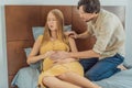 Expectant woman feels unwell, husband comforts and reassures her during a challenging pregnancy