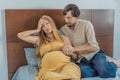 Expectant woman feels unwell, husband comforts and reassures her during a challenging pregnancy