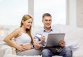 Expecting family with laptop and credit card Royalty Free Stock Photo