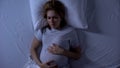Expecting female suffering insomnia at night, pregnancy difficulties, toxicosis