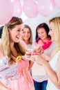 Expecting mother eating cupcake on baby shower party Royalty Free Stock Photo