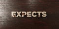 Expects - grungy wooden headline on Maple - 3D rendered royalty free stock image