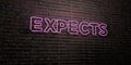 EXPECTS -Realistic Neon Sign on Brick Wall background - 3D rendered royalty free stock image