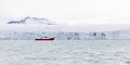 Expedition boat in front of a massive glacier Royalty Free Stock Photo