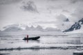 An expedition man reaching shores of Antarctica