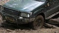 Expeditionary SUV got stuck in the mud in the forest, off-road