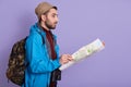 Expeditor backpacker map look orienteering direction, holding topographic map, expeditor find right way, guy wearing black jacket