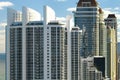 Expensive highrise hotels and condos on Atlantic ocean shore in Sunny Isles Beach city. American tourism infrastructure