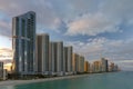 Expensive highrise hotels and condos over sandy beachfront on Atlantic ocean shore in Sunny Isles Beach city at sunset Royalty Free Stock Photo