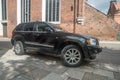 Expensive modern big 4WD suv car black Jeep parked