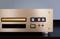 Expensive Stereo CD Player with Golden Front Panel Plays Music on Compact Disk