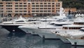 Expensive white yachts docked in harbor, luxury property of rich powerful people
