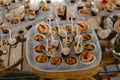 Expensively decorated table with tartlets and ice-cream in wooden utensils Royalty Free Stock Photo