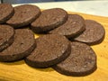 Close up of round chocolate chip cookies arranged on a wooden tray. Royalty Free Stock Photo