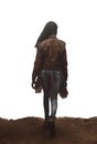 African american woman with long black braids walking away. rear view. leather jacket and jeans. Royalty Free Stock Photo