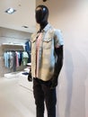 Dummy model wearing denim shirt and black pants in a department store. Royalty Free Stock Photo