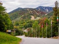 The ski olympic downhill ski slopes on Whiteface Mountain with flags outside Lake Placid, upstate New York during fall Royalty Free Stock Photo