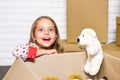 Experience the Lifestyle. happy little girl with toy. repair of room. new apartment. happy child cardboard box Royalty Free Stock Photo