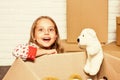 Experience the Lifestyle. happy little girl with toy. repair of room. new apartment. happy child cardboard box Royalty Free Stock Photo