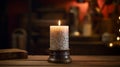 a Christmas candle on a rustic wooden table