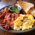 Sunrise Bliss: Scrambled Eggs, Crispy Bacon, and Golden Toast Medley