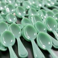 Neat Arrangement of Mint Green Plastic Spoons