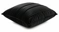 Plush black decorative pillow with elegant pleating detail for cozy home decor Royalty Free Stock Photo